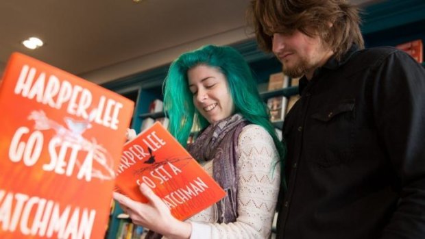 Tanika Mychael and Dean Mills peruse Harper Lee's <i>Go Set A Watchman</i> in Better Read Than Dead in Newtown.