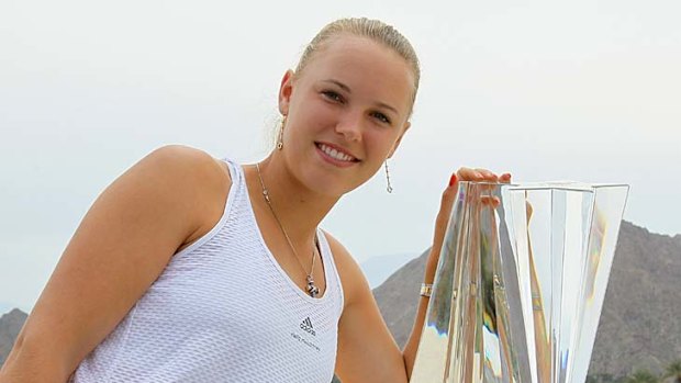 Caroline Wozniacki of Denmark poses with the trophy.