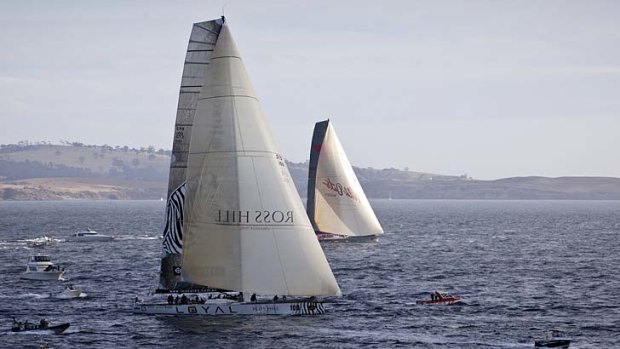 Photo finish ... Investec LOYAL takes line honours from Wild Oats last year.