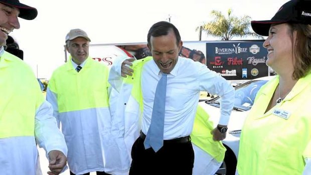 Opposition Leader Tony Abbott during his visit to a beef processing plant in Queensland yesterday.
