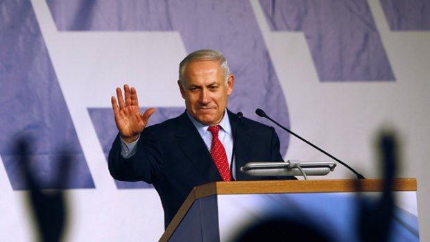 Likud leader Benjamin Netanyahu waves to supporters in Tel Aviv: "I am certain that I will be able to form the next government."