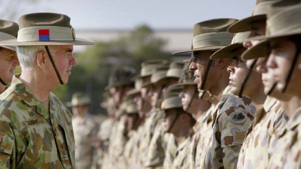 Forty-four years' service ... General Gillespie reviews troops in Darwin.