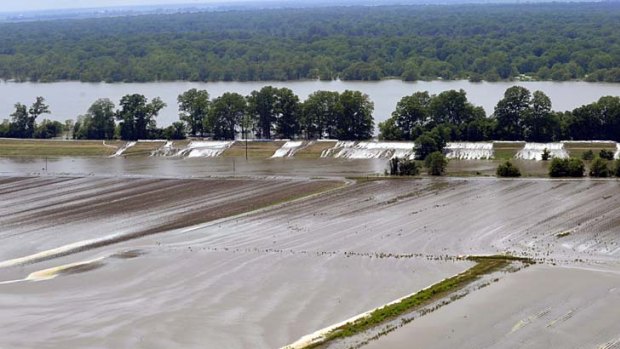 Crops and homes along a levee overflow near Lake Providence, Louisiana.