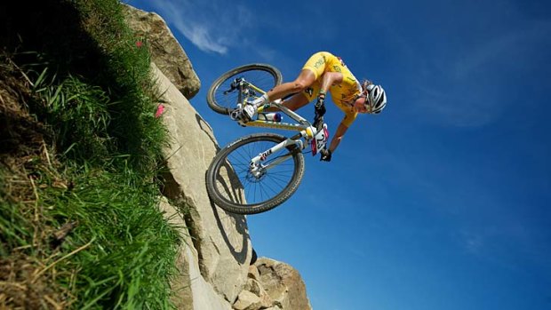 Getting vertical ... Australia's Rebecca Henderson takes a drop in the women's mountain biking.