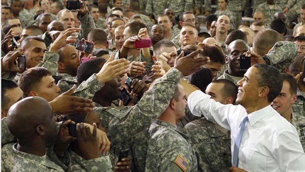 US President Barack Obama greets troops who have recently returned from duty in Afghanistan. The president also privately thanked some members of the team involved in the raid that killed Osama bin Laden.