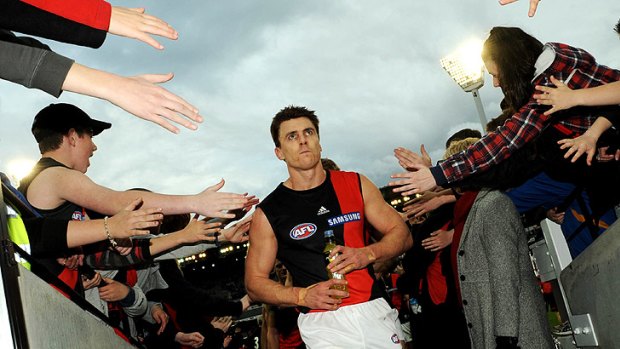 The end: Matthew Lloyd’s career is over as he leaves the ground after the round-22 game against Hawthorn in 2009. He missed Essendon’s sole final through suspension.