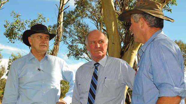 Picture this ... Tim Wright, right, tells Ross Garnaut and Tony Windsor about carbon storage on his property.