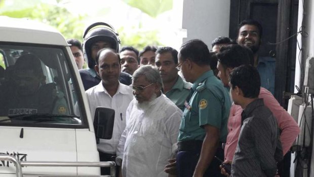 Ali Ahsan Mohammad Mojaheed, 65, secretary general of the Jamaat-e-Islami party, exits a court after the verdict of his trial, in front of the International Crimes Tribunal-2 in Dhaka.