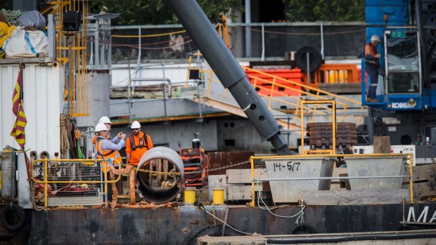 Scene at Barangaroo where a man, believed to be aged in his 30s, was working on a barge when he was struck by a metal object.