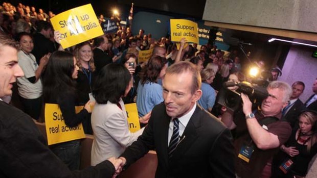 Tony Abbott greets supporters at yesterday's campaign launch.