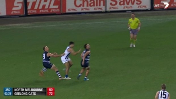 Lindsay Thomas dramatically exaggerates contact in the back against Geelong's James Kelly.