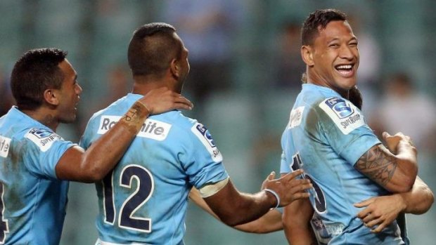 Happy days: Israel Folau celebrates the  Waratahs' win on Friday night.