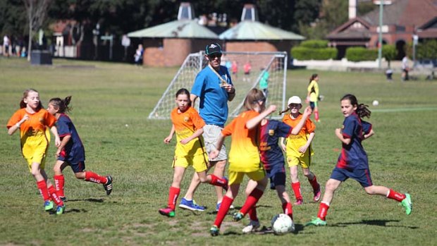 Girls just wanna have fun: Soccer at Queens Park on Sunday.