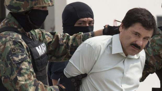 Joaquin "Shorty" Guzman  is escorted by Mexican security forces in Mexico City.