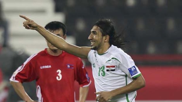 Iraq's Kerrar Jasim shows his glee after scoring what turned out to be the matchwinner for his team.