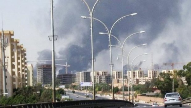 Smoke rises from the direction of Tripoli airport.