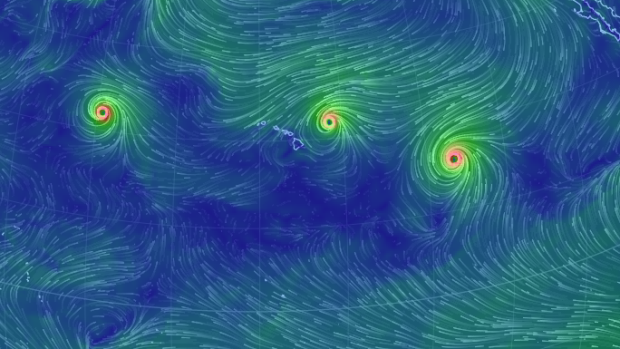 The trio of category-4 hurricanes spinning near the Hawaiian Islands.