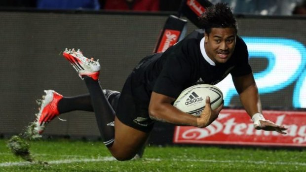Hat-trick hero: Julian Savea crosses the line but the try was disallowed for a forward pass.