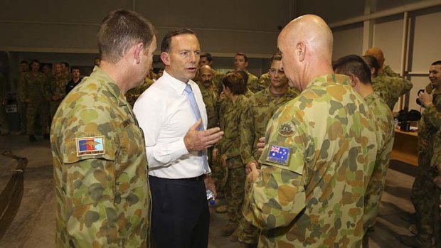 Tony Abbott meets Australian troops at Al Minhad Air Base in the United Arab Emirates on Thursday.