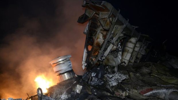 Smoke and flames in the wreckage of Malaysia Airlines flight MH17