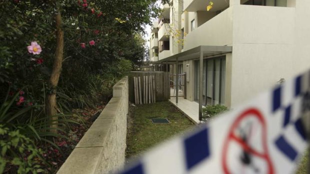 Balcony fall: police taped area at the rear of the apartment block where Henry Kwan died.