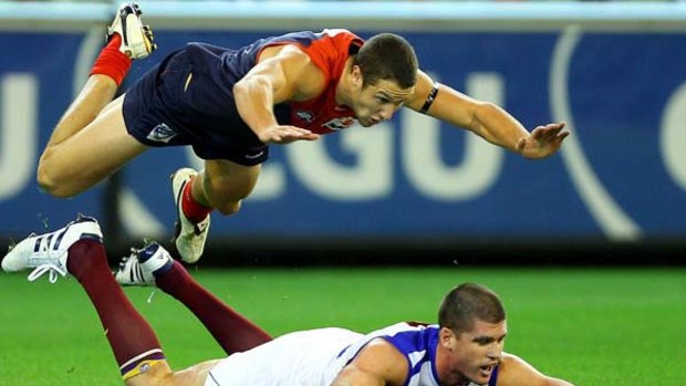 James Frawley leaps over Lions captain Jonathan Brown.