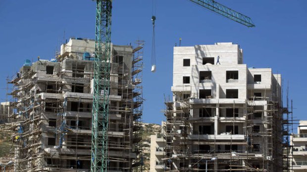 Labourers work at a housing construction site in the Israeli settlement of Har Homa in east Jerusalem.