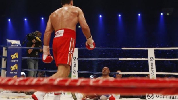 Over and out: Alex Leapai is knocked out by Wladimir Klitschko.