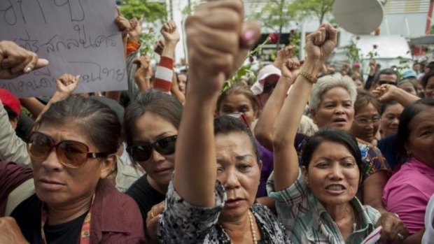 Supporters of former Thai prime minister, Yingluck Shinawatra, react to her removal from power.