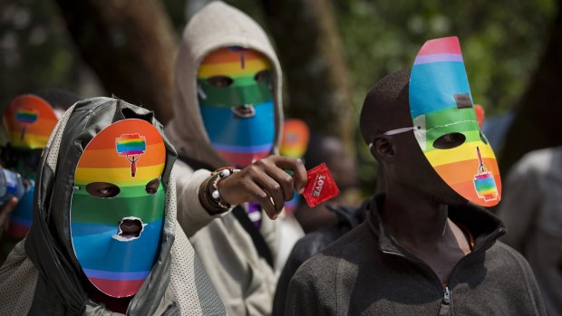 Kenyan people who identify as gay and lesbian and others supporting their cause wear masks to preserve their anonymity in Nairobi.