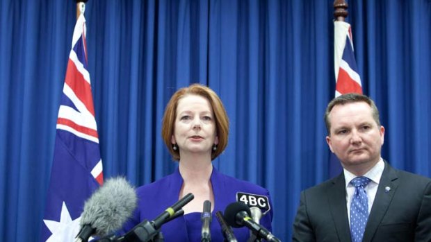 Another strike ... Julia Gillard and Immigration Minister Chris Bowen front the media to discuss the High Court ruling on the asylum seekeer swap deal on Thursday.