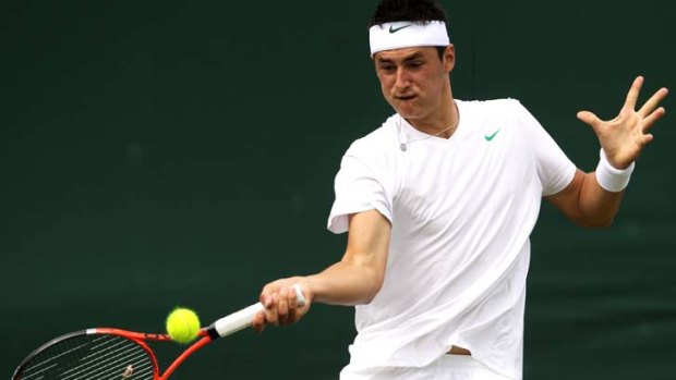 Stunning starter ... Bernard Tomic's straight-sets win over Russia's Nikolay Davydenko was a potent maiden main-draw victory at tennis's most hallowed event.