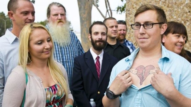 Donald Besch, 25, right, the son of Susan Mellen, shows a broken heart he had tattooed on his chest to honour her.