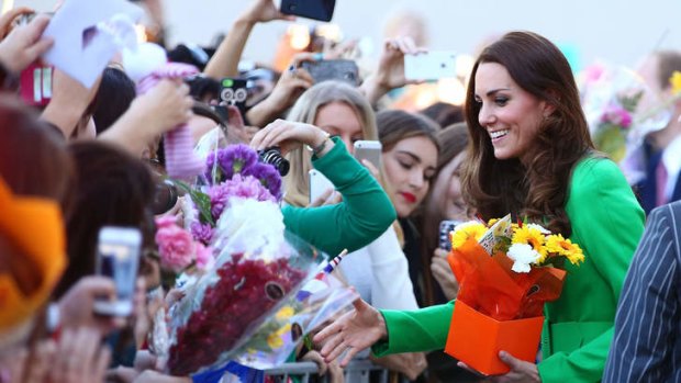 What happened to the flowers the visiting royals received? Duchess of Cambridge, Catherine, greeted by adoring fans, many with flowers.