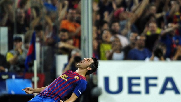 FC Barcelona's David Villa celebrates after scoring against AC Milan.