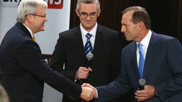 Kevin Rudd and Tony Abbott face off at the leaders' forum at the Broncos Leagues Club earlier this week.