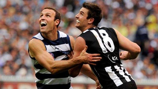 Geelong's Brad Ottens battles with Collingwood's Darren Jolly during the 2011 grand final.