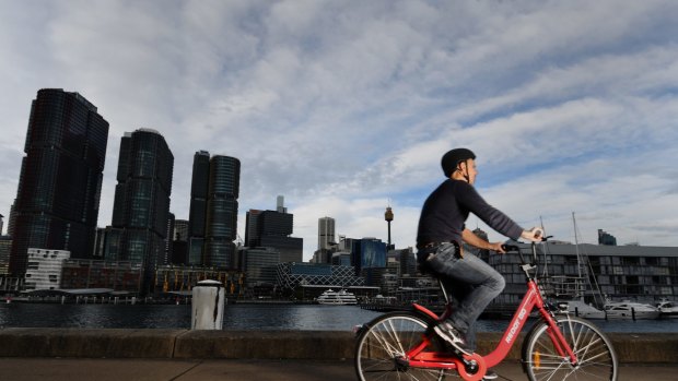 Andrew Taylor takes a Reddy Go hire bike for a test ride in Pyrmont, Sydney.