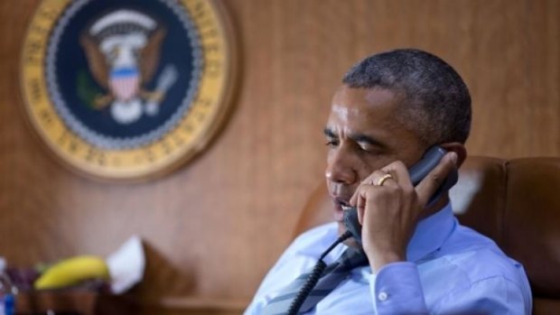 President Barack Obama talks on the phone aboard Air Force One with President Petro Poroshenko of Ukraine about the Malaysia Airlines plane crash.