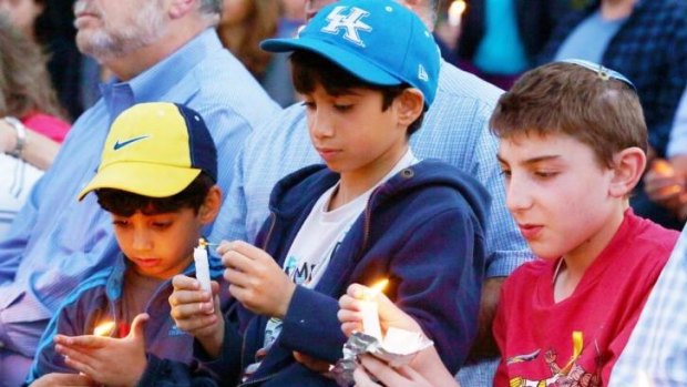 Children participate in a candlelight vigil for the kidnapped Israeli teenagers in Los Angeles.