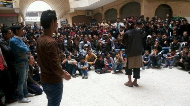 Brutal message: Islamic State members give a lecture in Raqqa, Syria.