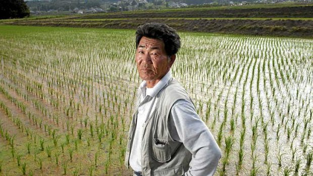 Rice farmer Katsuyuki Kuchiki in Kunimi, Japan. The price of rice has dipped, but growing demand could see a return to 2008's shortages, export bans and riots.