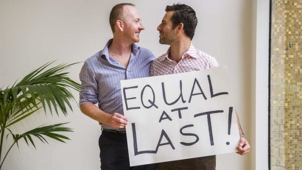 Nathan Thomas and Maikol Nobrega from Sydney at the ACT Legislative Assembly after the same-sex bill was passed. Photo: Rohan Thomson/The Canberra Times