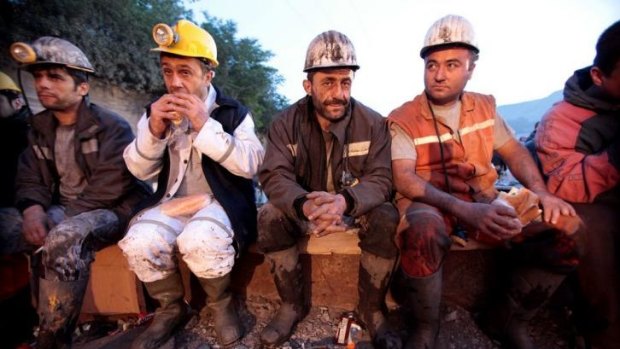 Miners await the rescue of their trapped workmates at a coal mine in Soma in western Turkey. The death toll from the explosion, mine collapse and fire is now 238.