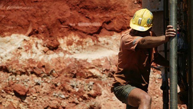 A miner at work in the Pilbara. Fly in, fly out - with pockets full of cash.