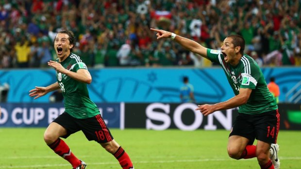 Andres Guardado  (left)  and Javier Hernandez of Mexico celebrate their team's second goal against Croatia. 