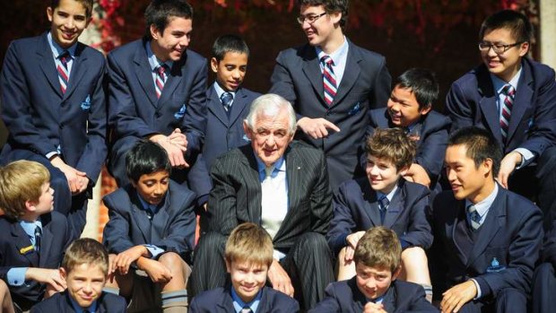 Terry Snow with Canberra Grammar School students after yesterday's announcement.