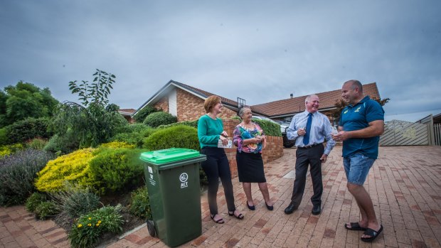 Calwell homeowner Stephen McDougall is happy to use one of the first green waste bins delivered to residents in Tuggeranong who have opted in for the service.