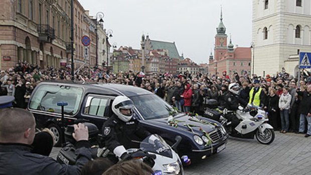 Nation in mourning ... a hearse bearing the coffin of late Polish President Lech Kaczynski drives through downtown Warsaw, Poland.
