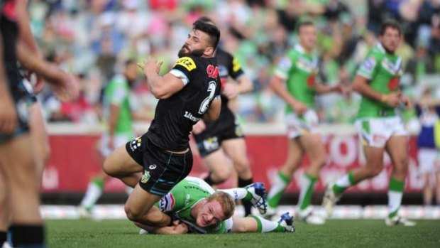 Penrith winger Josh Mansour gets hauled down against the Raiders earlier this season.